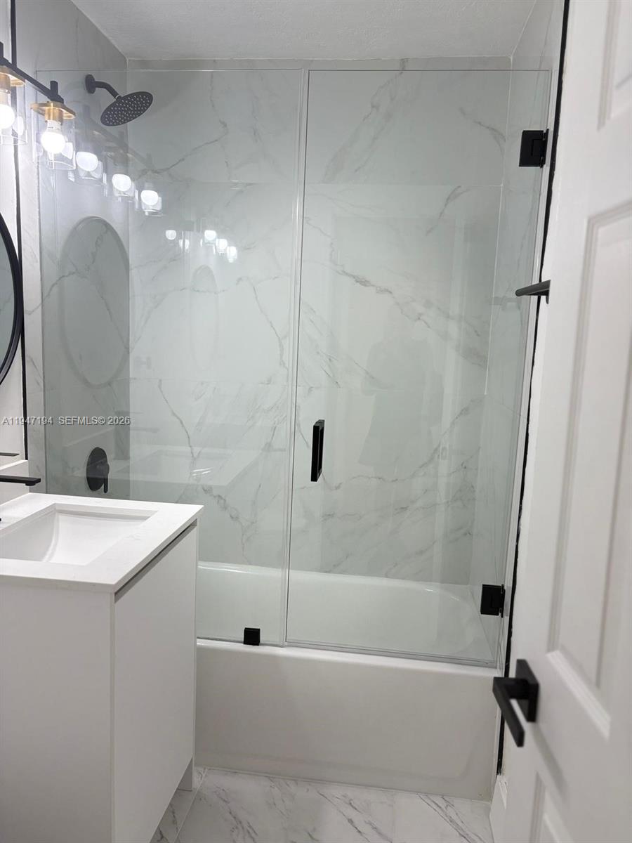 6104 Southwest 33rd Street Miramar, FL 33023 - Photo 10 of 31 a bathroom with a sink a toilet and shower