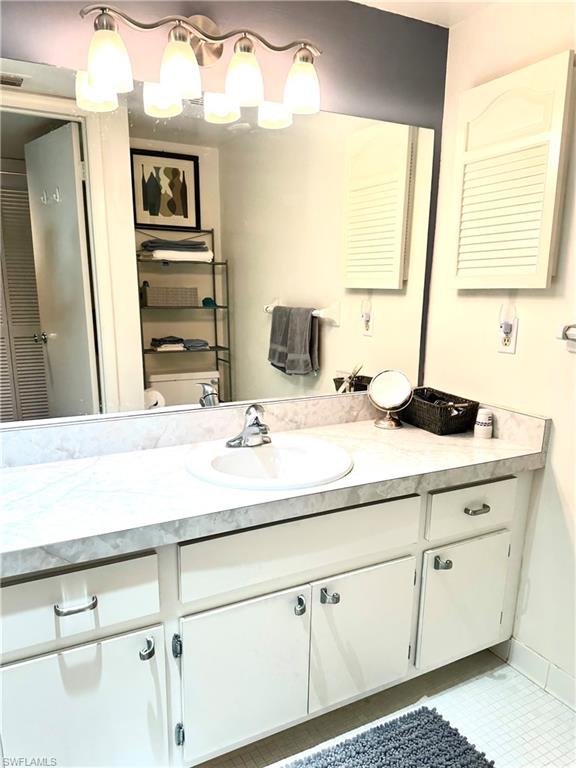 214 Bobolink Way, Unit 214B Naples, FL 34105 - Photo 12 of 15 Bathroom with tile patterned flooring, vanity, and toilet