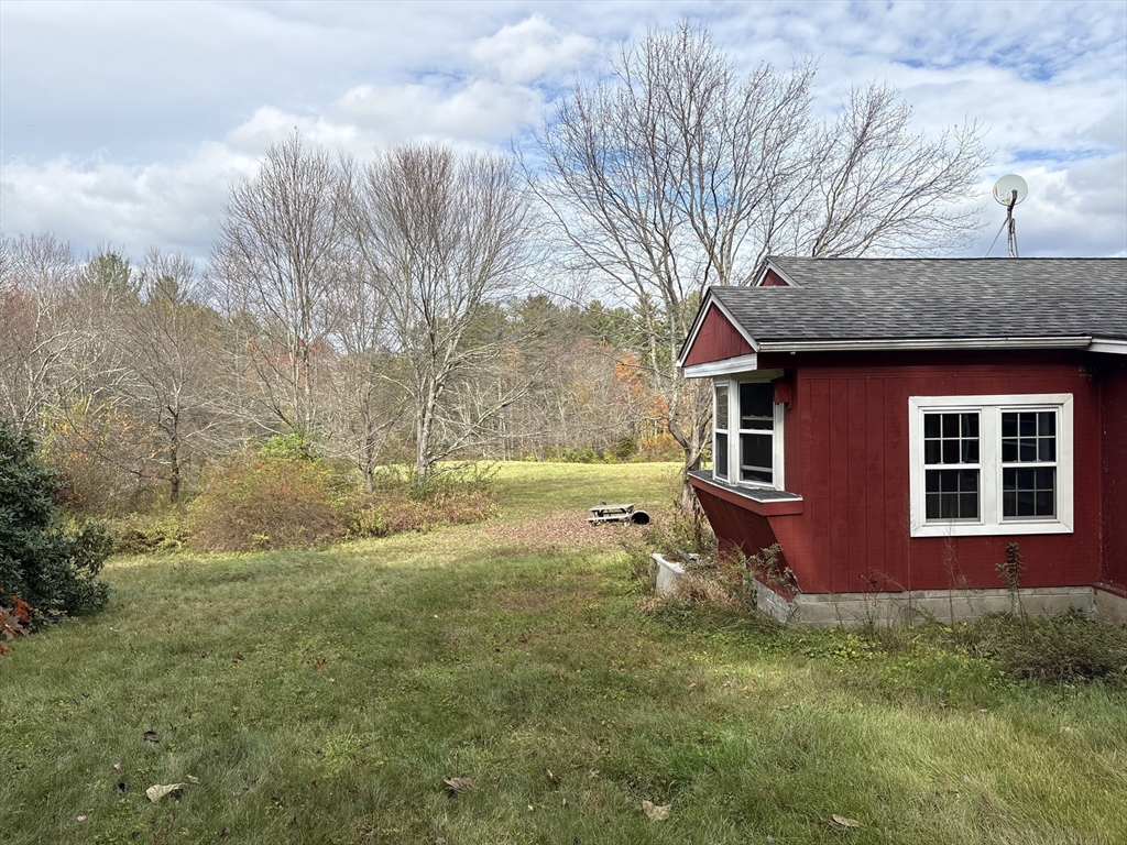194 Old Greenwich Plain Road Hardwick, MA 01082 - Photo 6 of 13 a backyard of a house with yard and trampoline