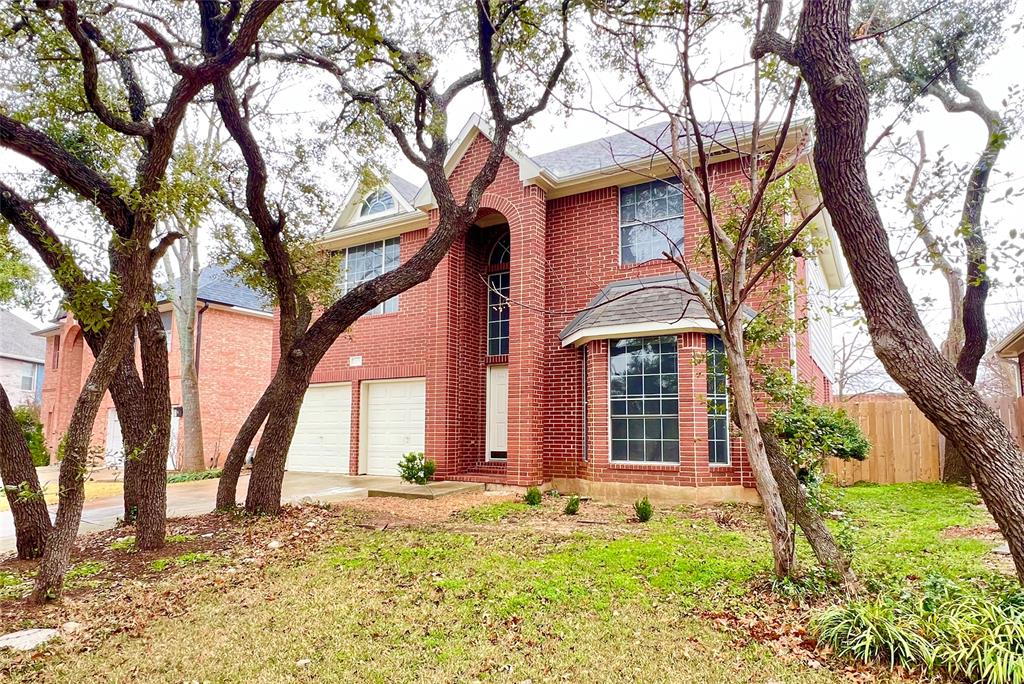 1809 Springwater Drive Round Rock, TX 78681 - Photo 2 of 25 View of front facade featuring brick siding and concrete driveway