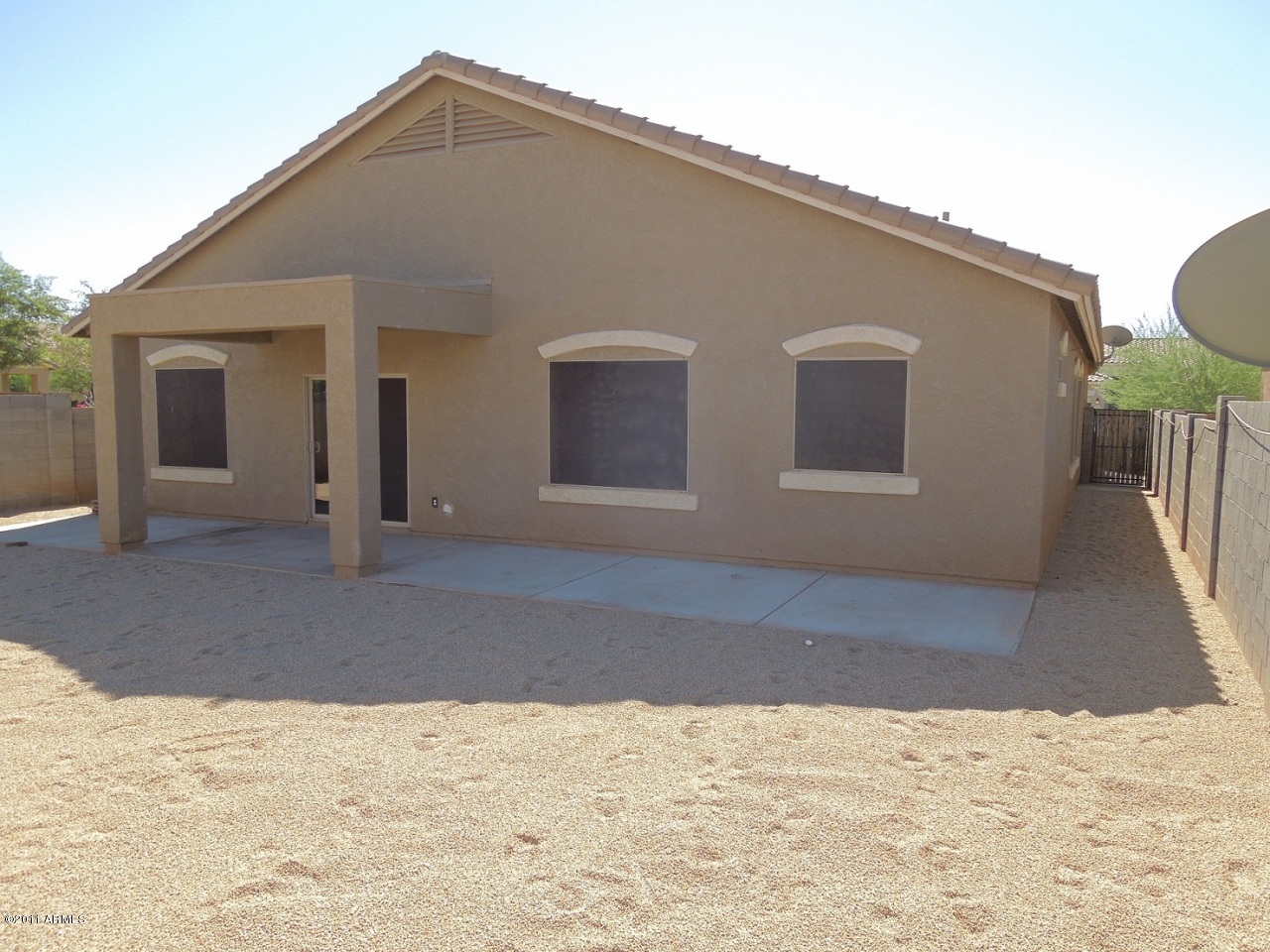 7026 West Beverly Road Laveen, AZ 85339 - Photo 24 of 24 24_LargeQuietBackYardWithExtendedPorch