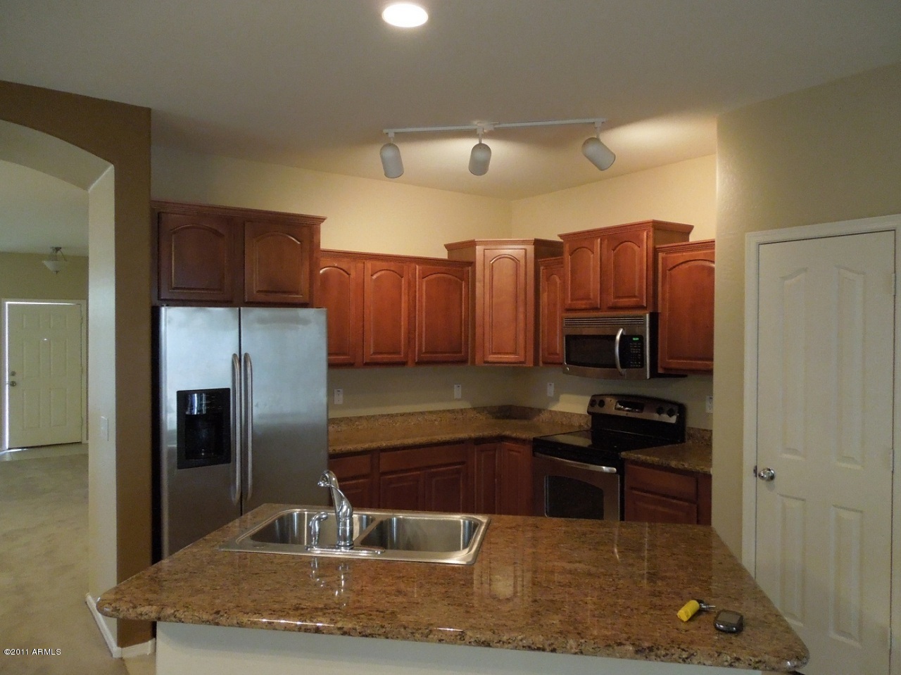 7026 West Beverly Road Laveen, AZ 85339 - Photo 6 of 24 6_GraniteStainlessKitchen