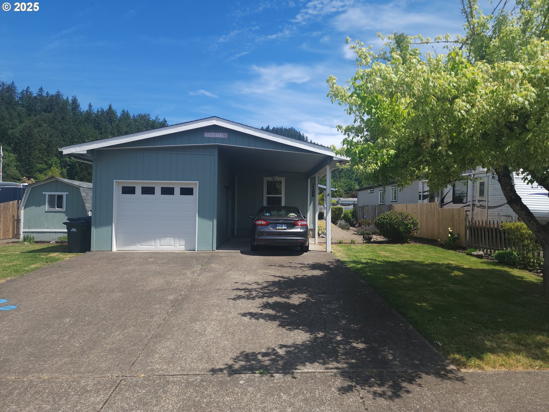 1199 South 58th Street Springfield, OR 97478 - Photo 1 of 30 a front view of a house with garden