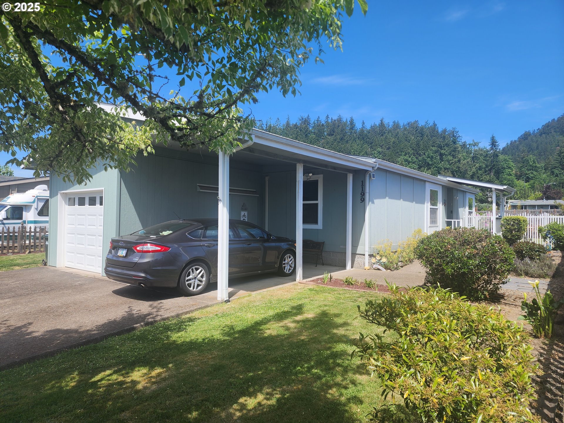 1199 South 58th Street Springfield, OR 97478 - Photo 2 of 30 a view of a house with a yard
