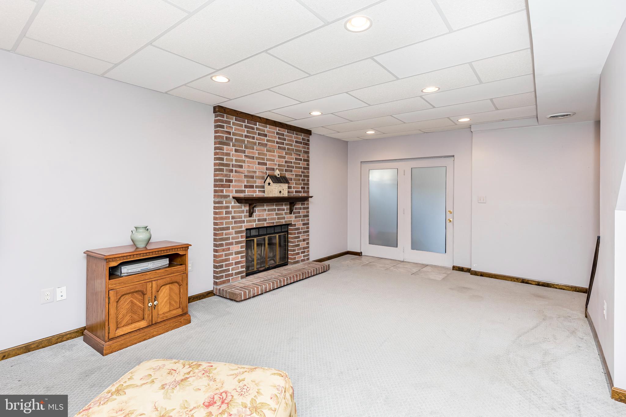 1550 South Rolling Road Baltimore, MD 21227 - Photo 55 of 75 Lower level basement with fireplace