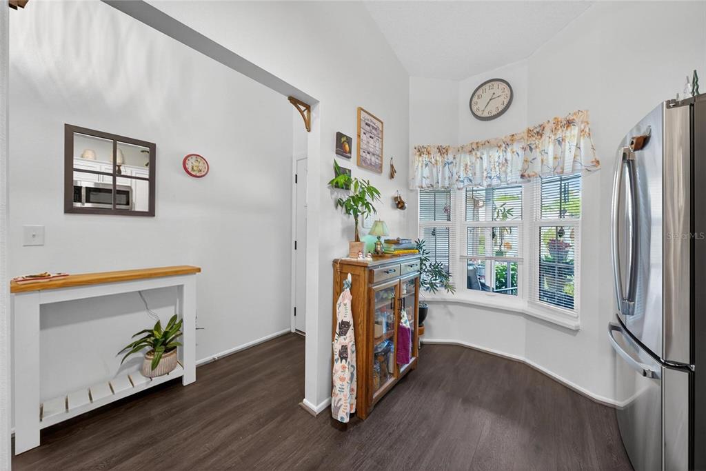 6506 Thicket Trail New Port Richey, FL 34653 - Photo 15 of 71 a view of a hallway with wooden floor and windows