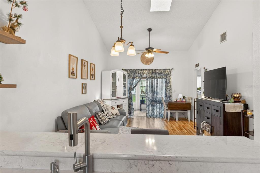 6506 Thicket Trail New Port Richey, FL 34653 - Photo 19 of 71 a view of living room with furniture and a flat screen tv