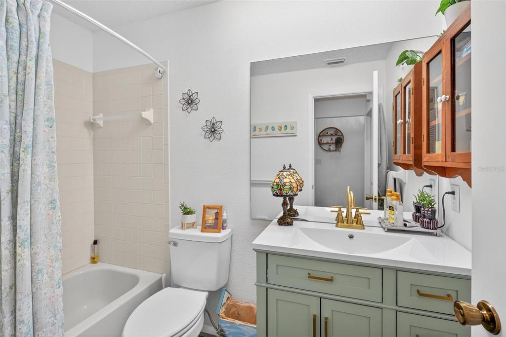 6506 Thicket Trail New Port Richey, FL 34653 - Photo 37 of 71 a bathroom with a sink toilet and shower