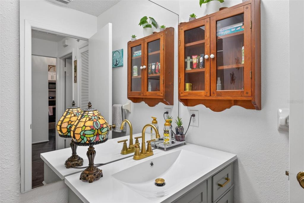 6506 Thicket Trail New Port Richey, FL 34653 - Photo 38 of 71 a bathroom with a sink and a mirror