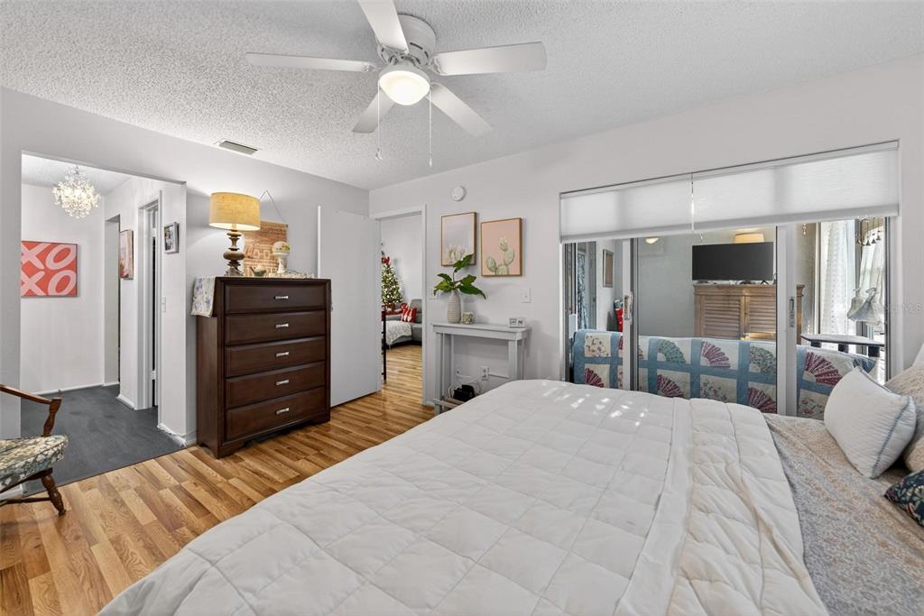 6506 Thicket Trail New Port Richey, FL 34653 - Photo 43 of 71 a bedroom with a bed and ceiling fan