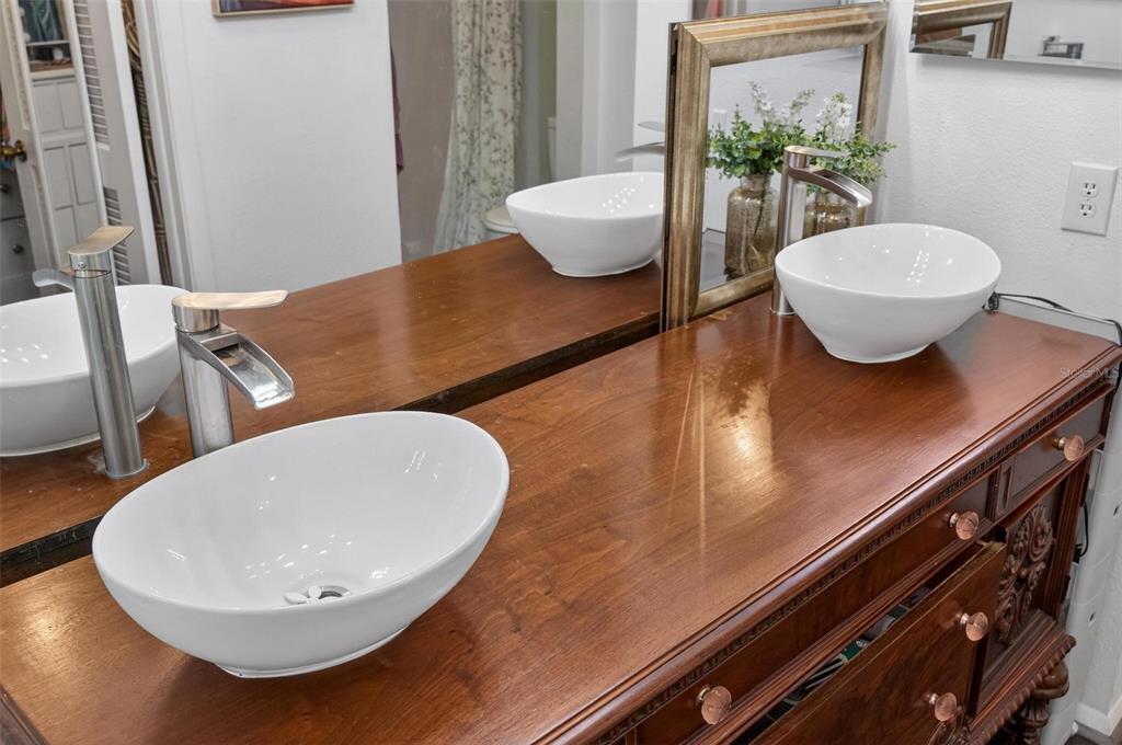 6506 Thicket Trail New Port Richey, FL 34653 - Photo 45 of 71 a bathroom with a granite countertop sink and a mirror
