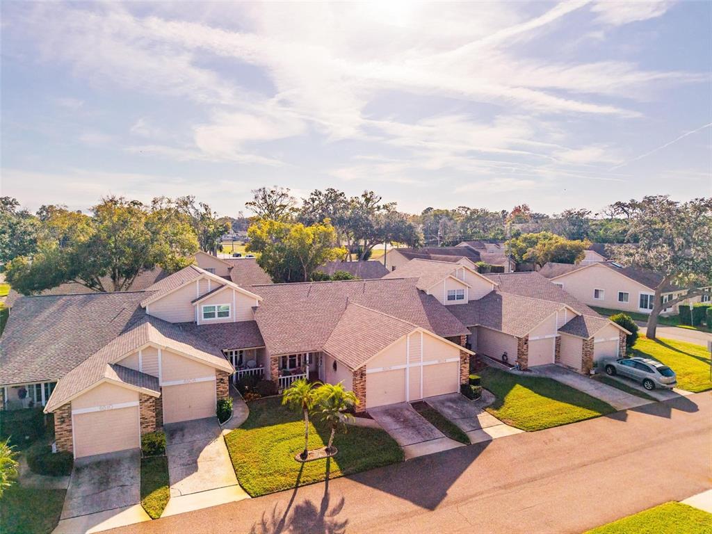 6506 Thicket Trail New Port Richey, FL 34653 - Photo 54 of 71 an aerial view of a house with a swimming pool