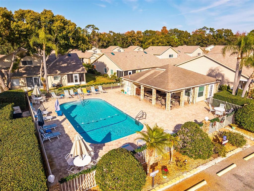 6506 Thicket Trail New Port Richey, FL 34653 - Photo 66 of 71 an aerial view of a house with a swimming pool