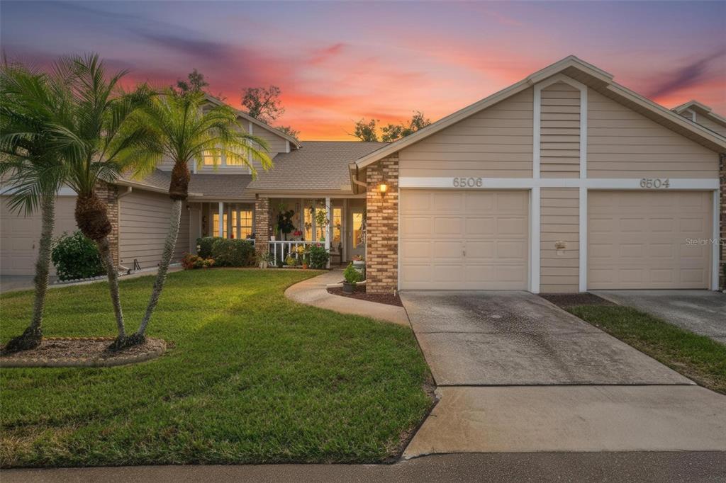6506 Thicket Trail New Port Richey, FL 34653 - Photo 71 of 71 a front view of house with a yard and potted plants
