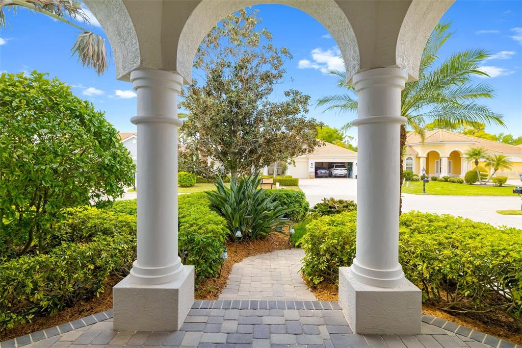 1016 Scherer Way Osprey, FL 34229 - Photo 11 of 76 a front view of a building with garden