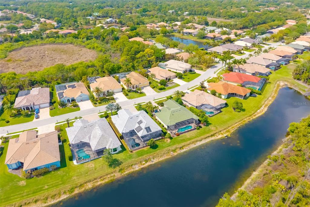 1016 Scherer Way Osprey, FL 34229 - Photo 14 of 76 an aerial view of residential houses with outdoor space