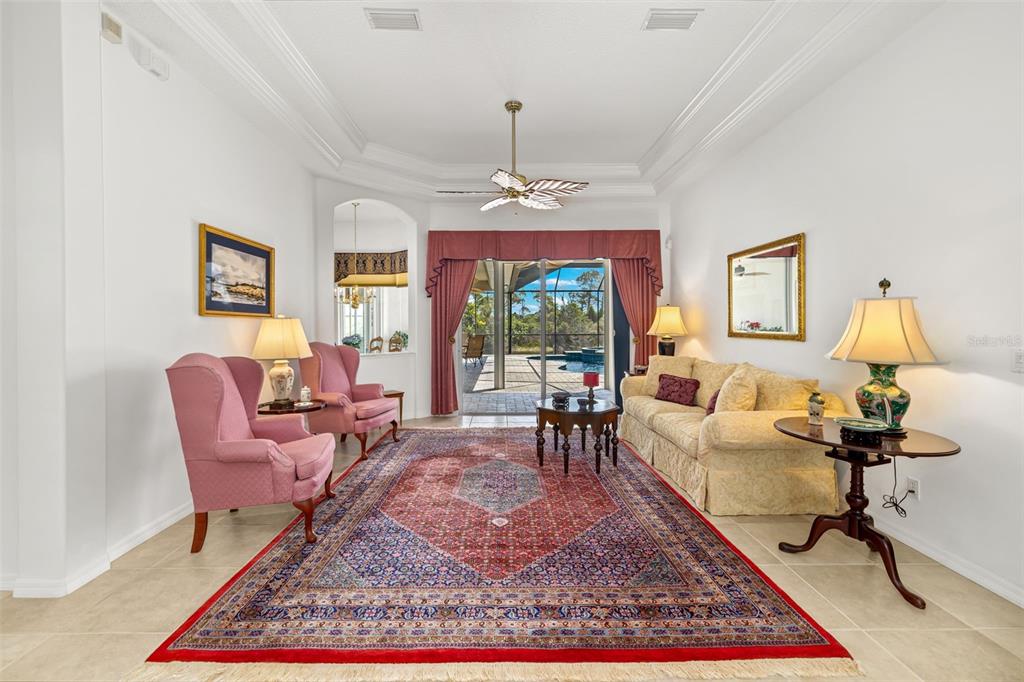 1016 Scherer Way Osprey, FL 34229 - Photo 20 of 76 a living room with furniture a rug and a window