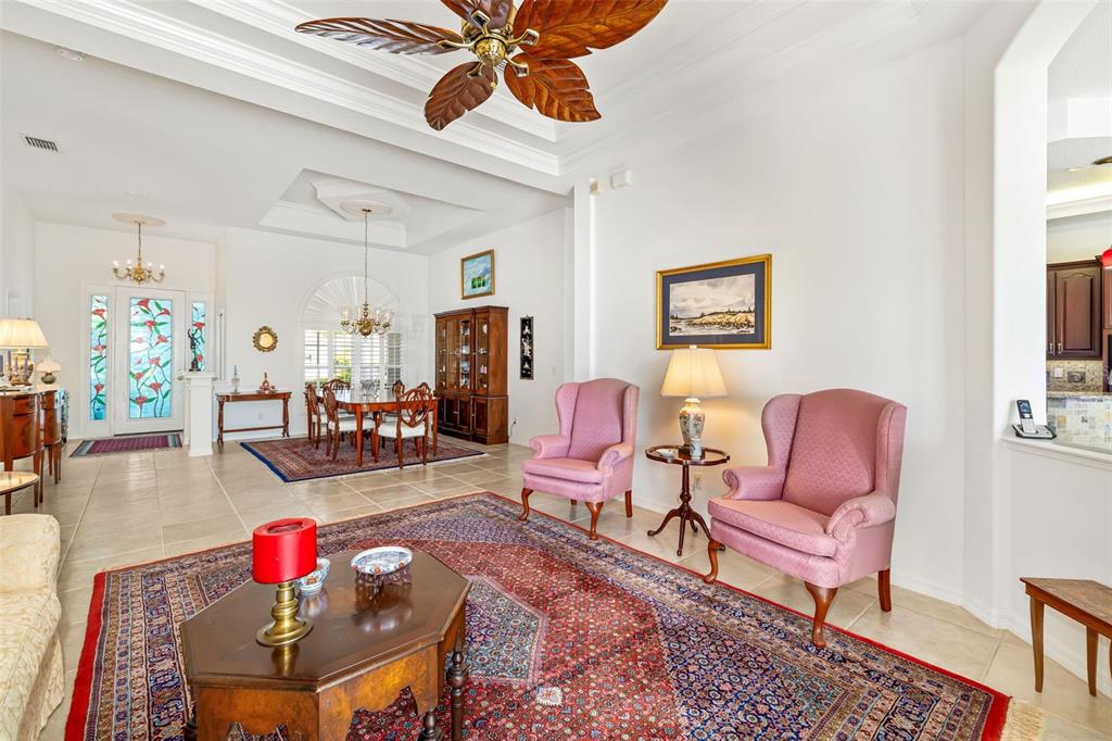 1016 Scherer Way Osprey, FL 34229 - Photo 21 of 76 a living room with furniture and wooden floor