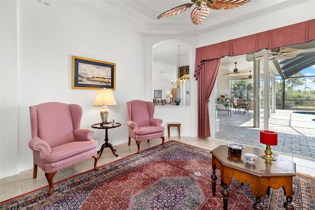 1016 Scherer Way Osprey, FL 34229 - Photo 22 of 76 a living room with furniture a rug and a table