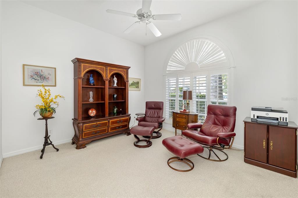1016 Scherer Way Osprey, FL 34229 - Photo 31 of 76 a living room with furniture and a window