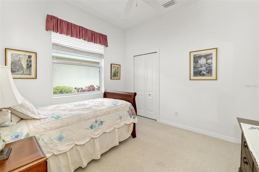 1016 Scherer Way Osprey, FL 34229 - Photo 32 of 76 a bedroom with a bed and a window