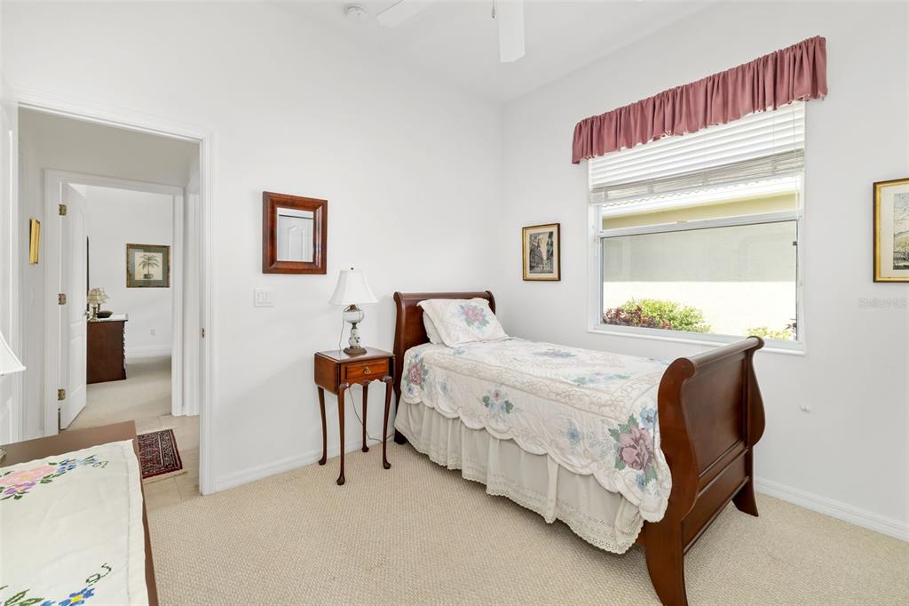 1016 Scherer Way Osprey, FL 34229 - Photo 33 of 76 a bedroom with a bed and a dresser