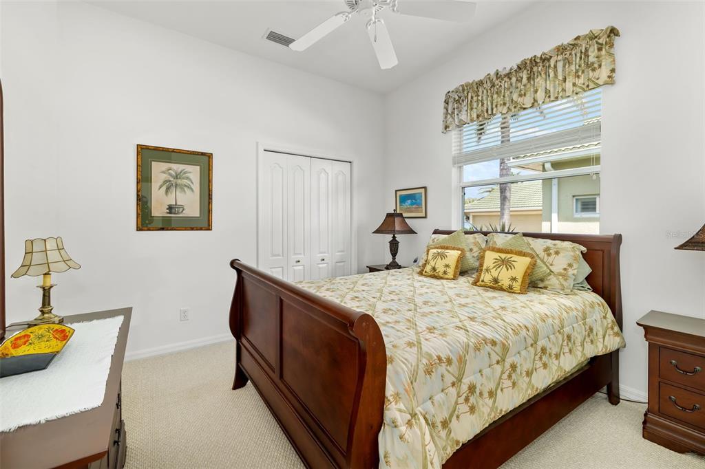 1016 Scherer Way Osprey, FL 34229 - Photo 36 of 76 a bedroom with a bed and a window