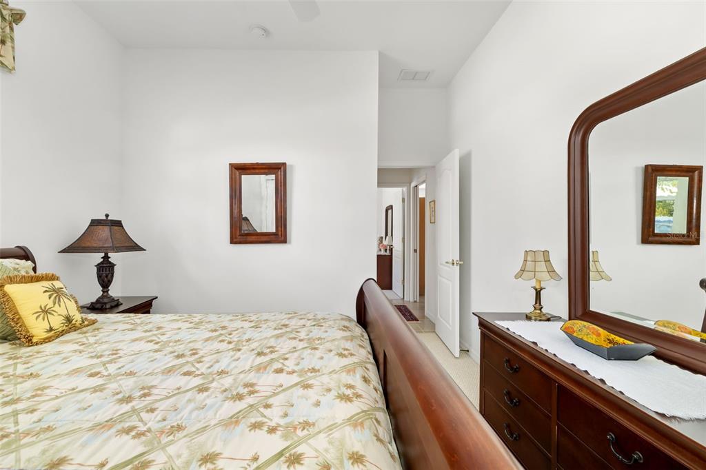 1016 Scherer Way Osprey, FL 34229 - Photo 37 of 76 a bedroom with a bed and a dresser