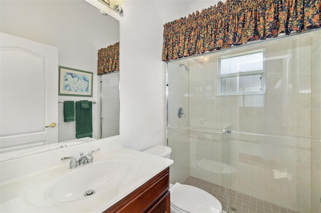 1016 Scherer Way Osprey, FL 34229 - Photo 38 of 76 a bathroom with a sink a toilet and shower