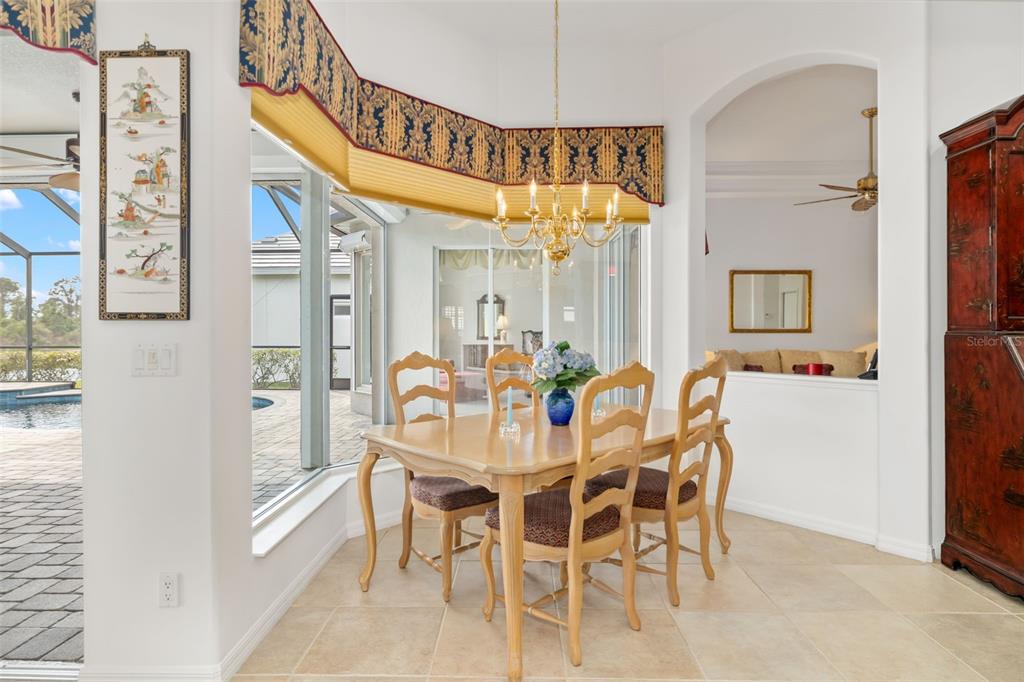 1016 Scherer Way Osprey, FL 34229 - Photo 43 of 76 a view of a dining room with furniture and a chandelier