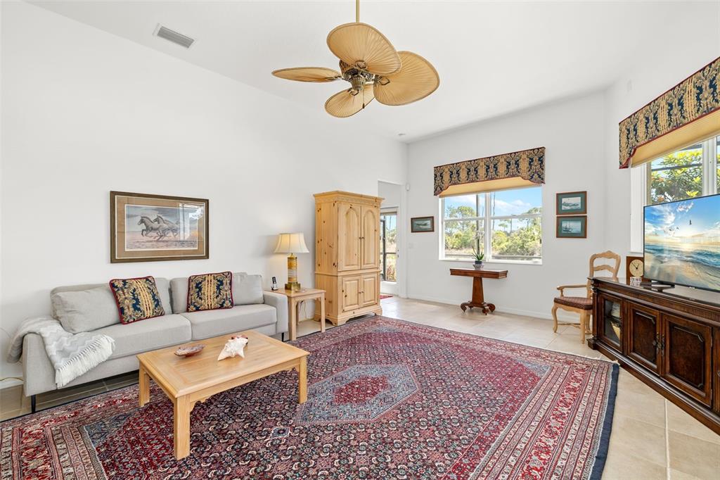 1016 Scherer Way Osprey, FL 34229 - Photo 44 of 76 a living room with furniture and a window