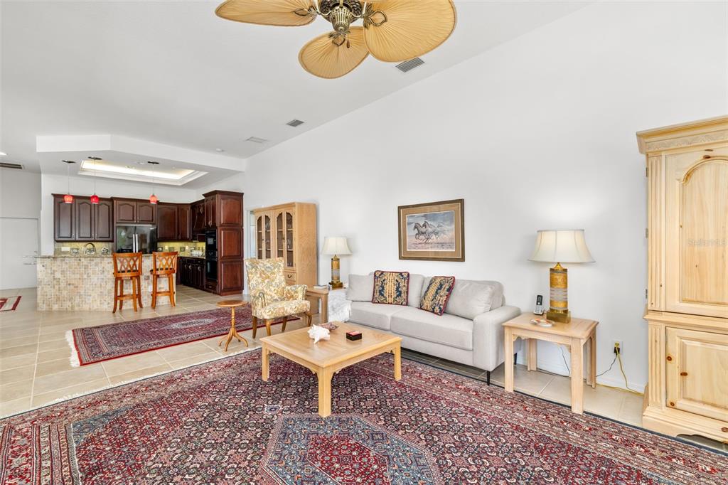 1016 Scherer Way Osprey, FL 34229 - Photo 45 of 76 a living room with furniture and wooden floor