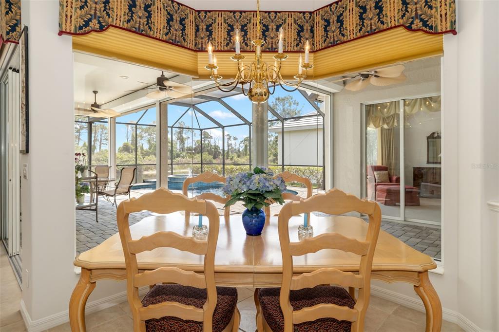 1016 Scherer Way Osprey, FL 34229 - Photo 53 of 76 a view of a dining room with furniture and chandelier