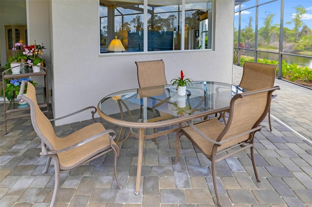 1016 Scherer Way Osprey, FL 34229 - Photo 57 of 76 a view of a chairs and table in patio