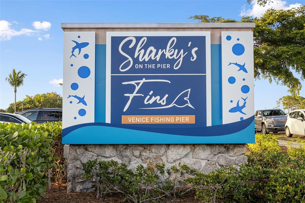 1016 Scherer Way Osprey, FL 34229 - Photo 68 of 76 a view of outdoor space with signage and flags