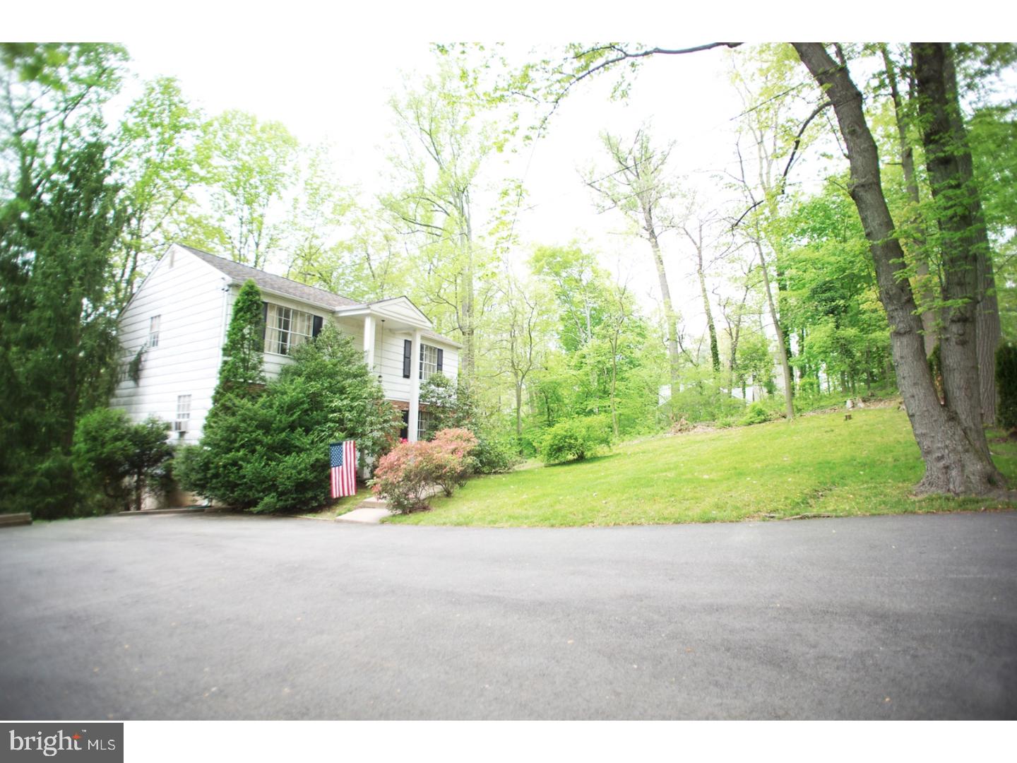 630 Ellis Road Havertown, PA 19083 - Photo 2 of 5 a backyard of a house with trees and trampoline
