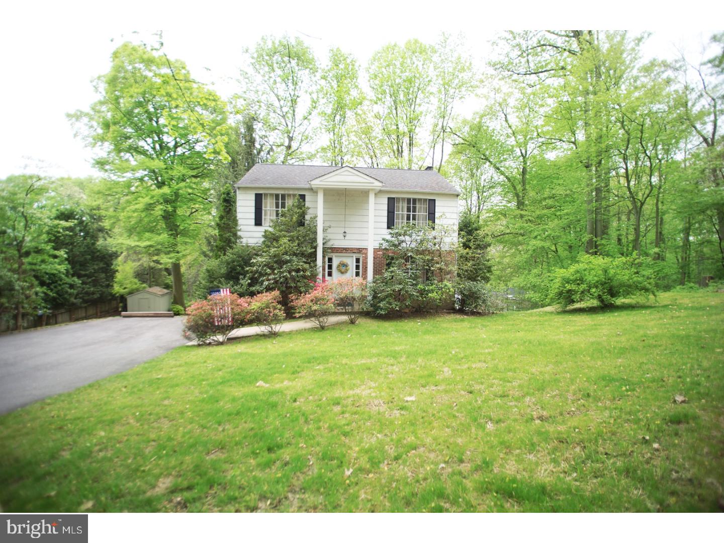 630 Ellis Road Havertown, PA 19083 - Photo 3 of 5 a front view of a house with a garden