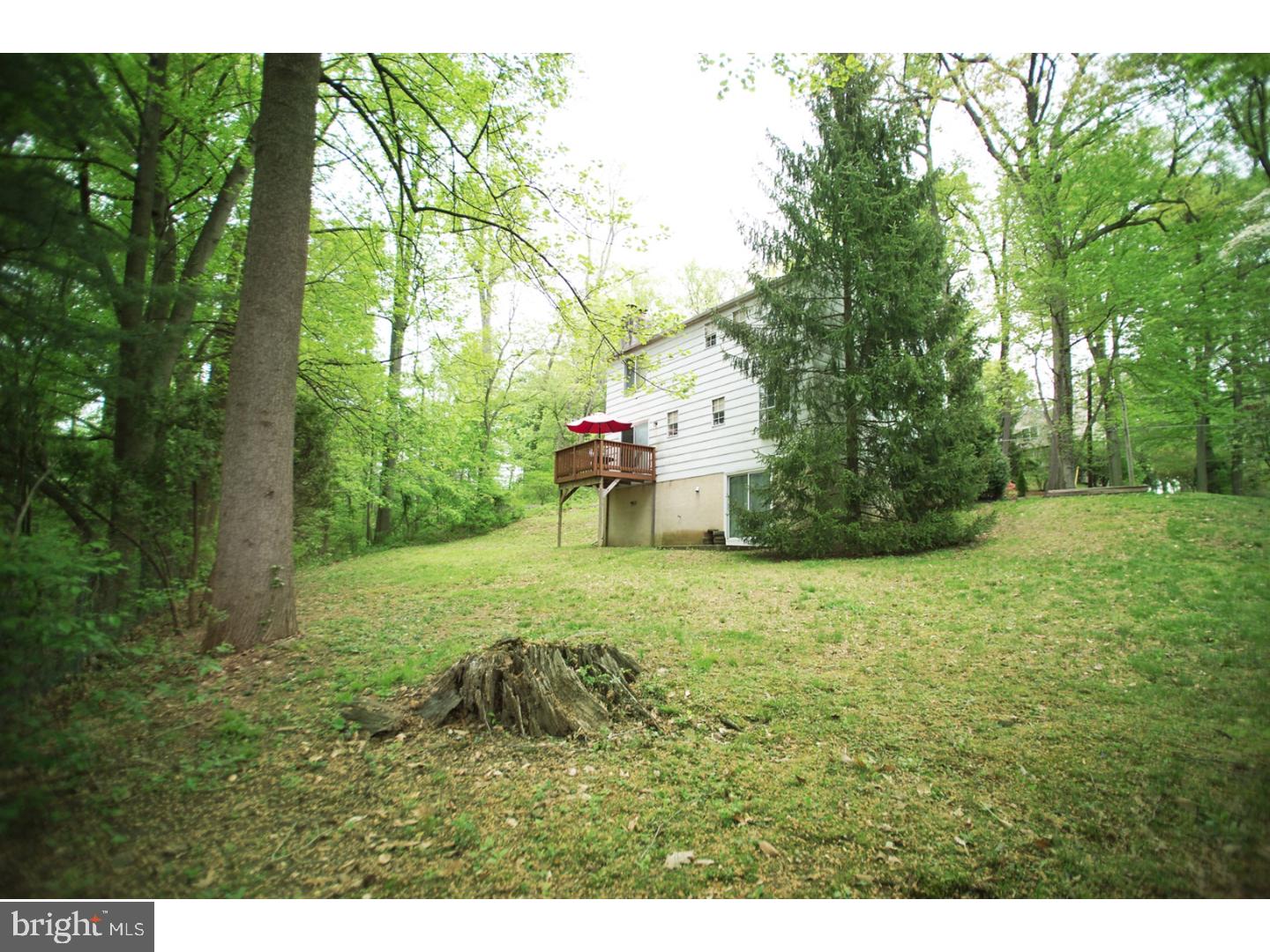 630 Ellis Road Havertown, PA 19083 - Photo 4 of 5 a backyard of a house with a yard and outdoor seating