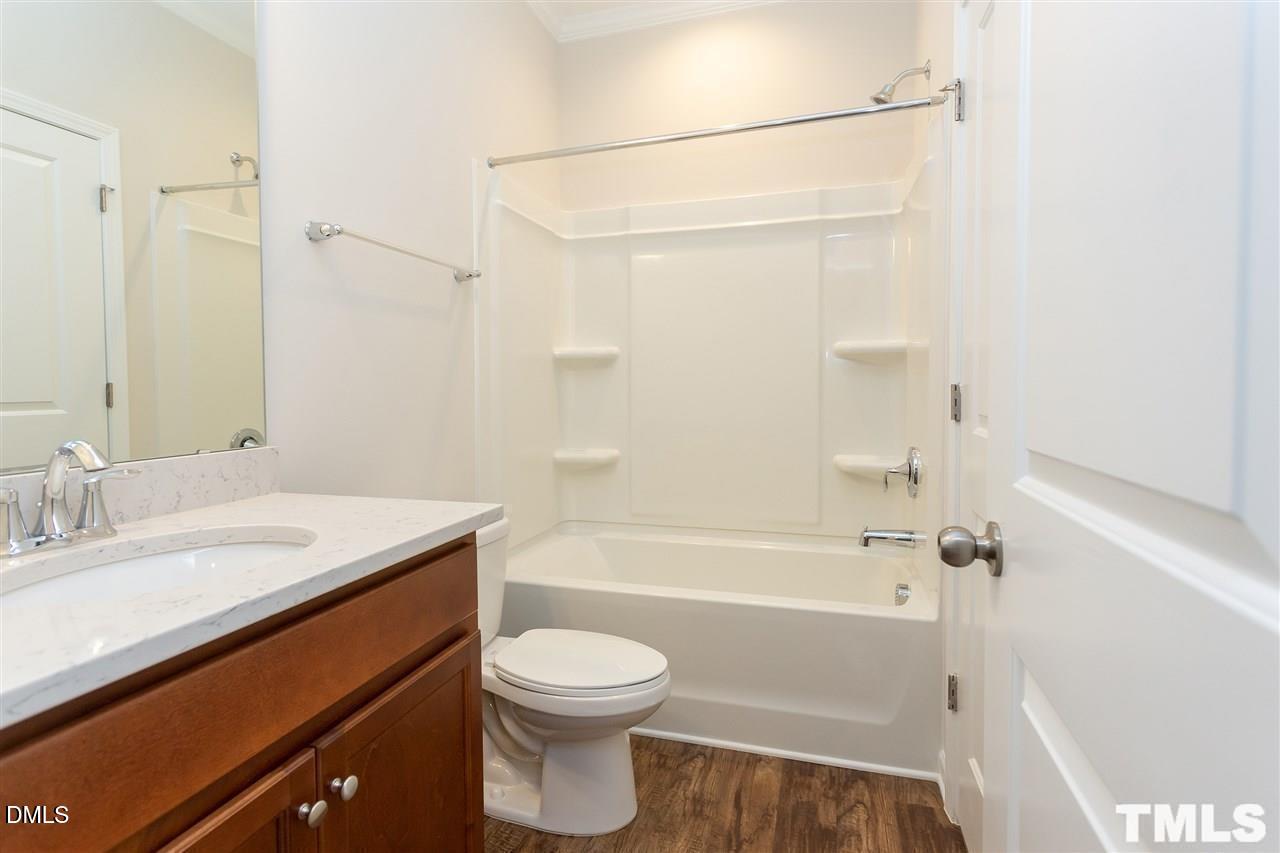 6507 Academic Avenue Raleigh, NC 27616 - Photo 6 of 11 a bathroom with a sink a toilet and shower