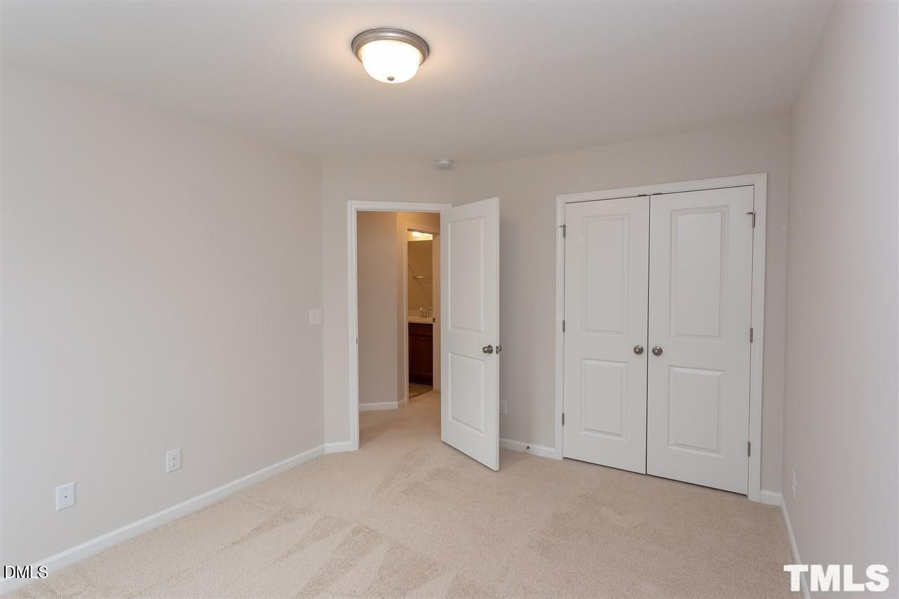 6507 Academic Avenue Raleigh, NC 27616 - Photo 9 of 11 an empty room with closet area