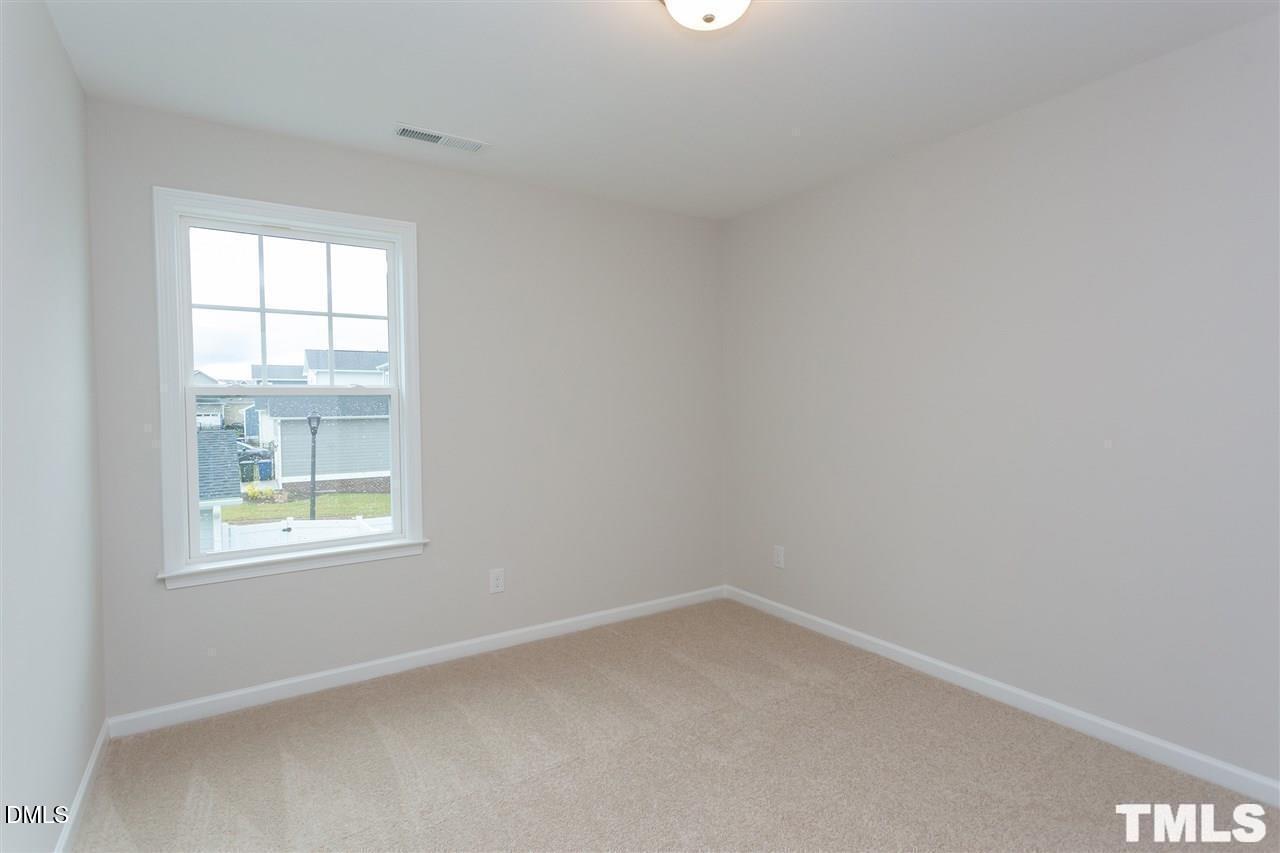 6507 Academic Avenue Raleigh, NC 27616 - Photo 10 of 11 an empty room with a window
