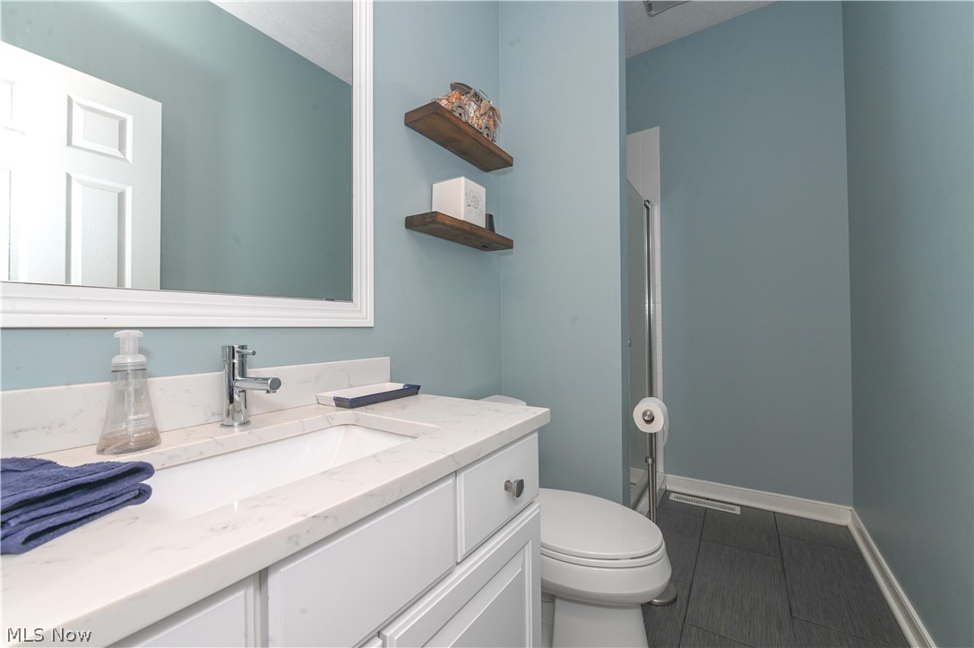 1688 Sheridan Road South Euclid, OH 44121 - Photo 30 of 48 Bathroom featuring vanity, tile floors, and toilet