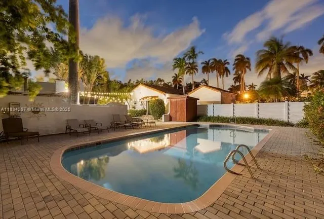 a view of a swimming pool with a lounge chairs
