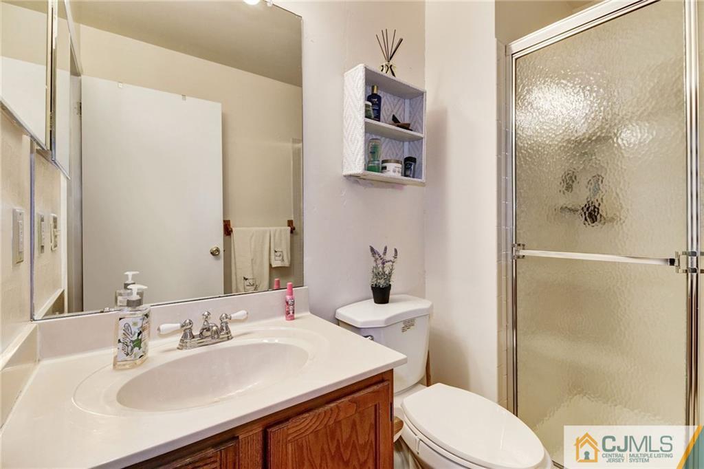 601 Porter Way West Bridgewater, NJ 08807 - Photo 11 of 15 a bathroom with a sink toilet and shower