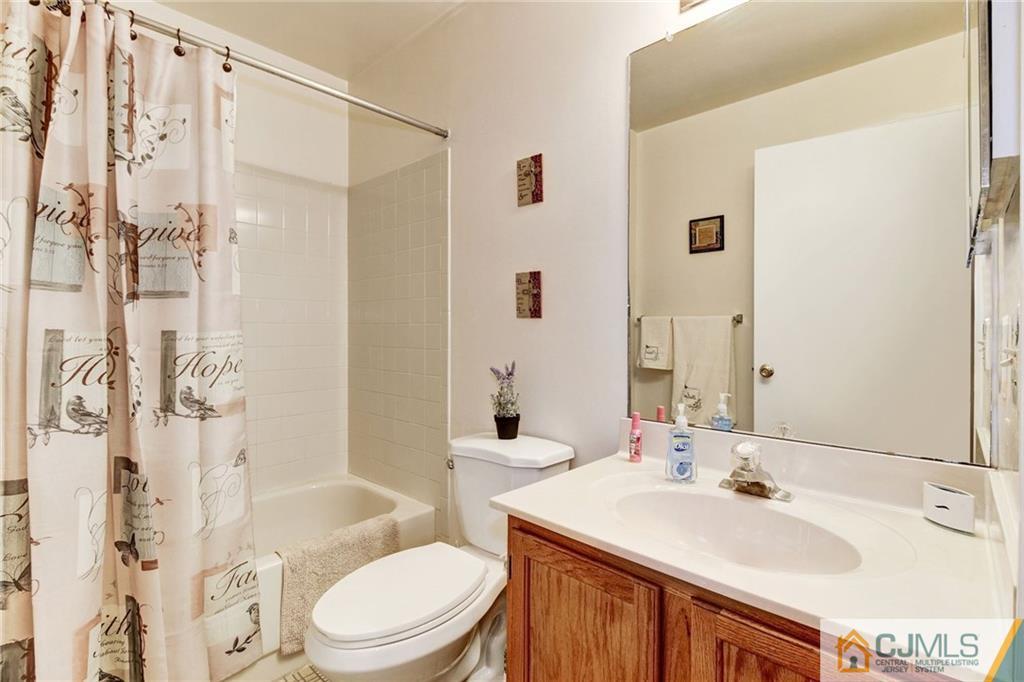 601 Porter Way West Bridgewater, NJ 08807 - Photo 12 of 15 a bathroom with a sink toilet and shower