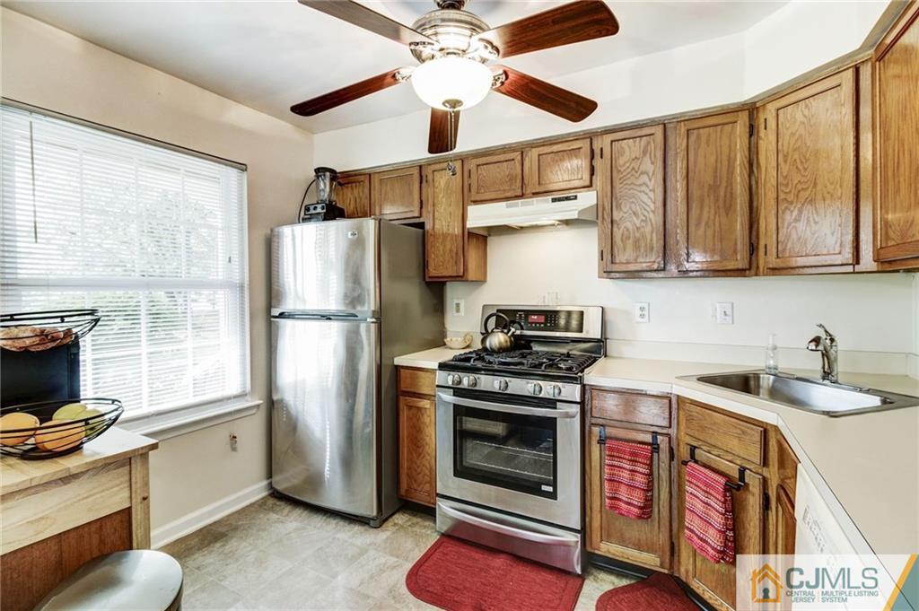 601 Porter Way West Bridgewater, NJ 08807 - Photo 4 of 15 a kitchen with stainless steel appliances granite countertop a stove a refrigerator and a sink