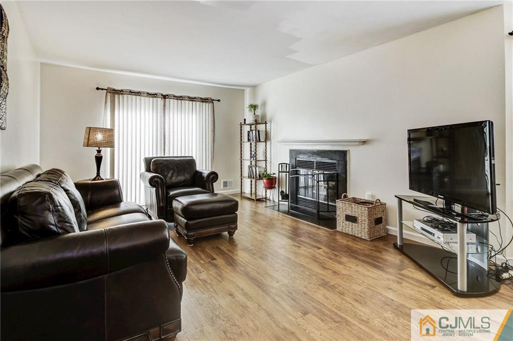 601 Porter Way West Bridgewater, NJ 08807 - Photo 7 of 15 a living room with furniture and a flat screen tv