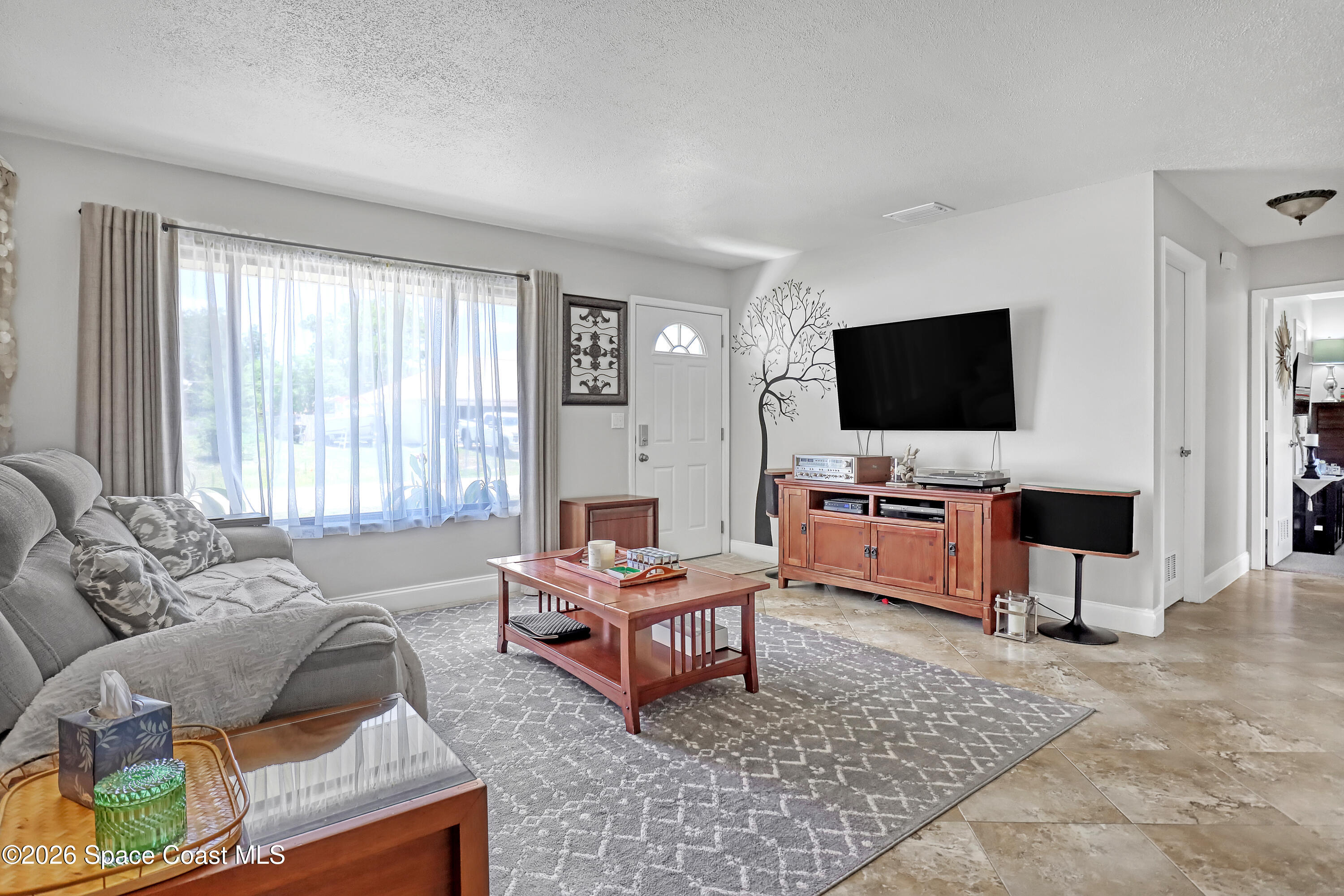 858 Carnival Road Southeast Palm Bay, FL 32909 - Photo 4 of 21 Living Room East View