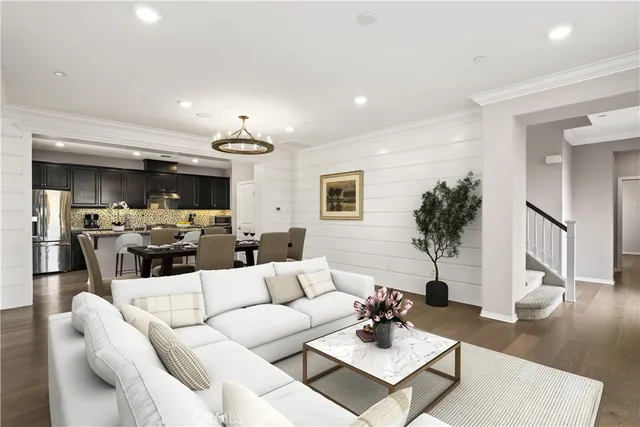 a living room with furniture potted plant and a window