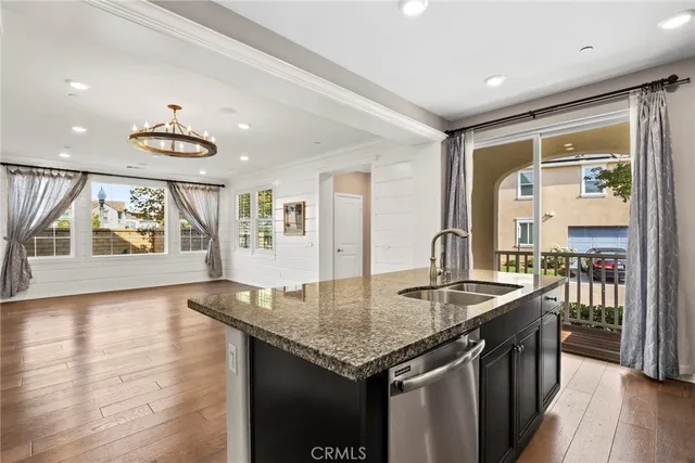 a kitchen with center island table and chairs in it